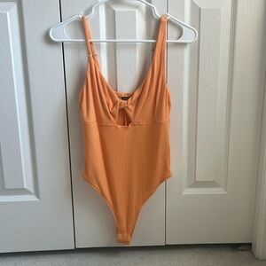 I am selling this never worn orange body suit by Wild Fable at Target!